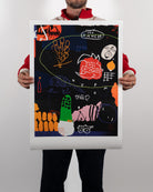 Premium unframed archive art print How to Contact Aliens by RETRO23 held by a person in an artist studio setting.