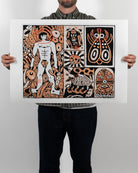 Full shot of a person holding the physical Die Dächse Kommen Näher fine art print by RETRO23 in front of their body, showing the artwork centered with a wide white border.