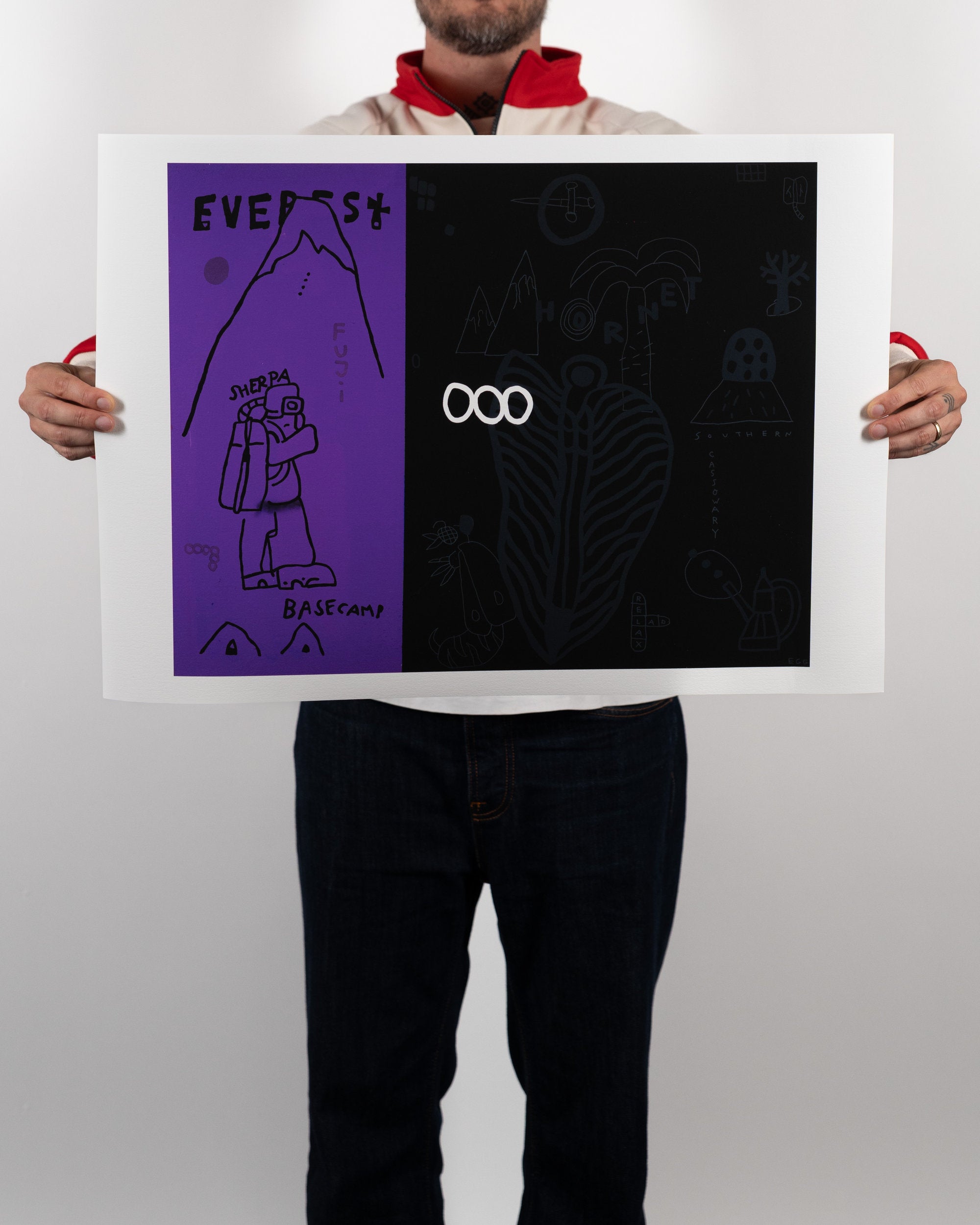Full shot of a person holding the physical Nashville Hot Chicken fine art print by RETRO23, showing the purple and black artwork centered with a wide white border.