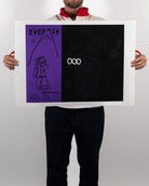 Full shot of a person holding the physical Nashville Hot Chicken fine art print by RETRO23, showing the purple and black artwork centered with a wide white border.