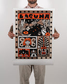 Full shot of a person holding the physical Night Swim fine art print by RETRO23 in front of their body, showing the artwork centered with a wide white border.